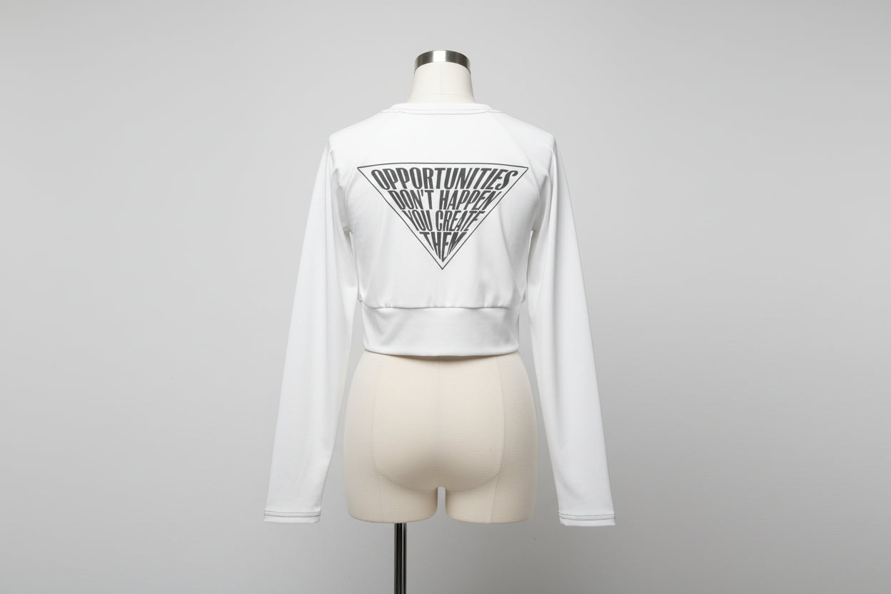 Recycled long-sleeve crop top in white — back view showing all-over print graphic design, UPF 50+