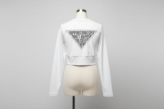 Recycled long-sleeve crop top in white — back view showing all-over print graphic design, UPF 50+